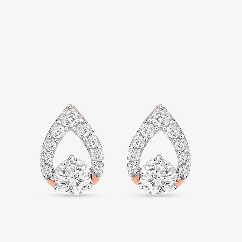 Imperial Teardrop Diamond Stud Earrings by Keemti Jewels feature pavé diamonds outlining their pear-shaped design.