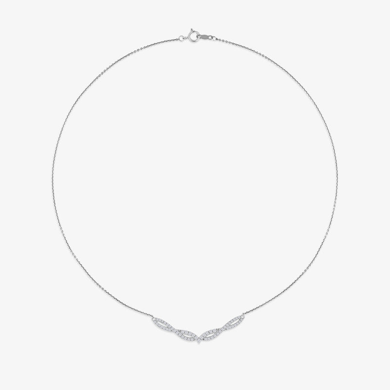 The Luna Chevron Diamond Necklet by Keemti Jewels features a slim chain and a diamond-studded chevron pendant.