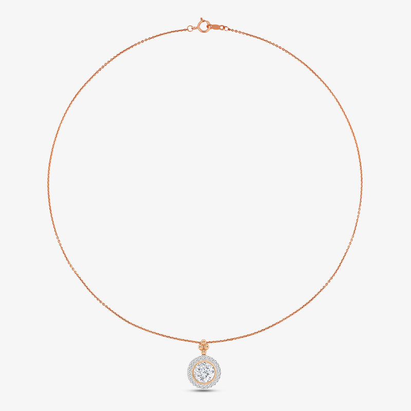 The Grace Halo Diamond Pendant by Keemti Jewels adds workwear elegance with its rose gold and sparkling diamonds.