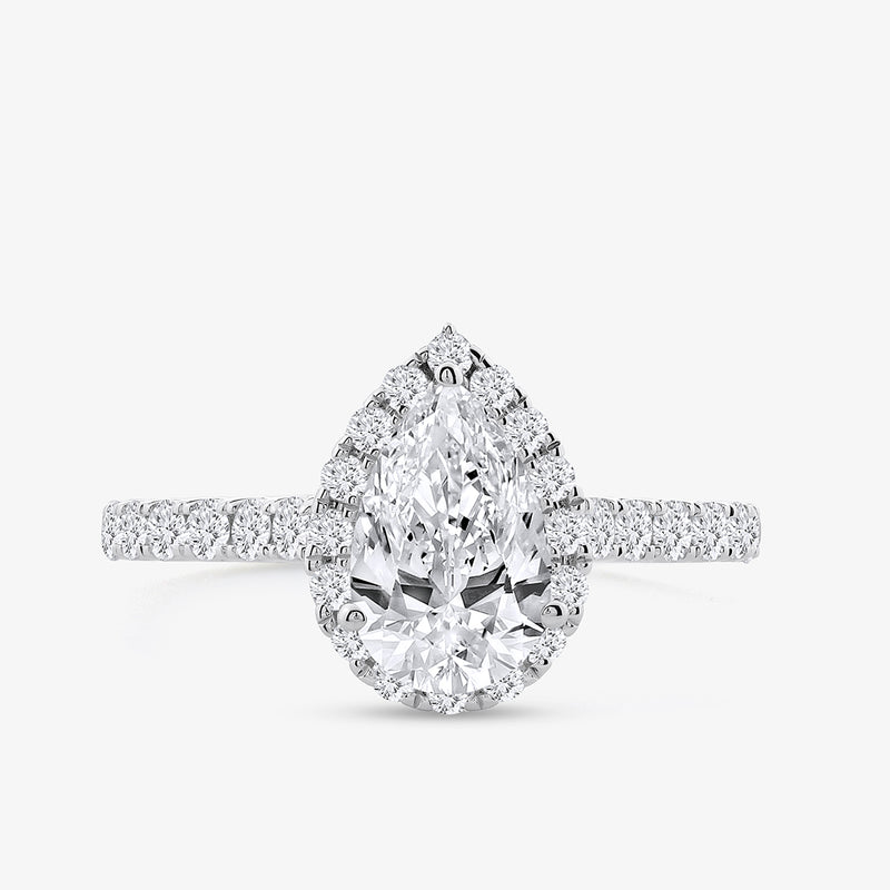 The Pear Tiered Halo Diamond Ring by Keemti Jewels features a pear diamond and pavé band in a halo setting.