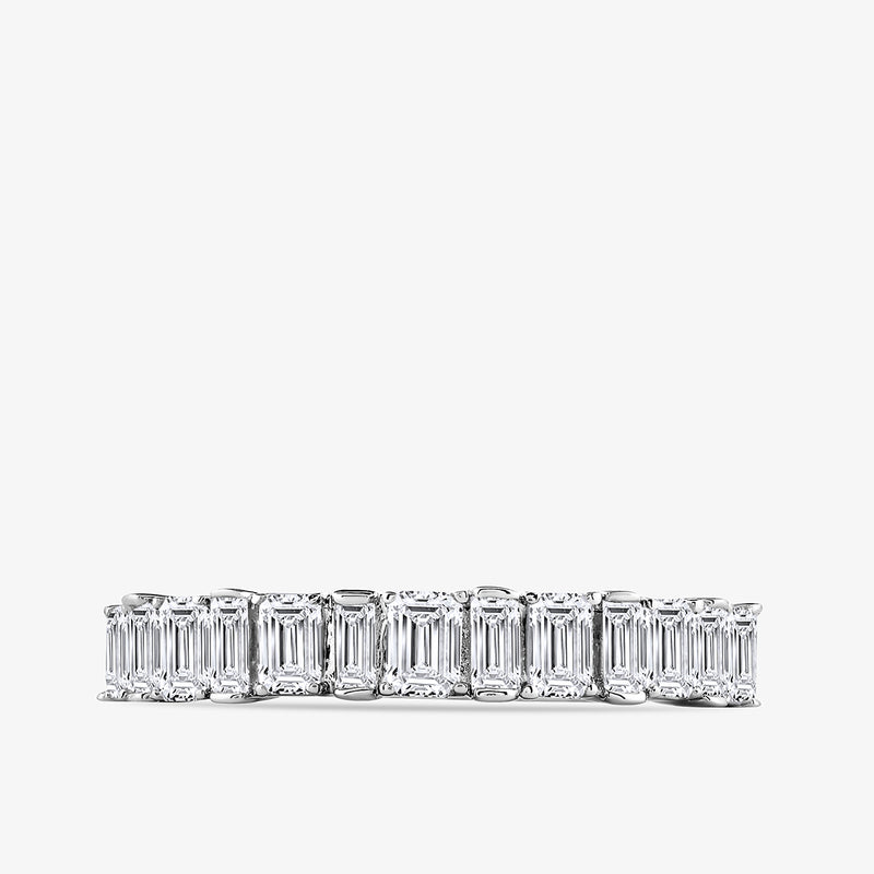 Keemti Jewels' Step Cut Diamond Ring features rectangular, emerald-cut diamonds in a platinum band, shown on white.