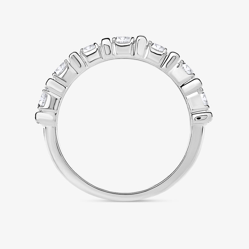 The Keemti Jewels Step Cut Diamond Ring features seven gemstones elegantly set along the top of the band.