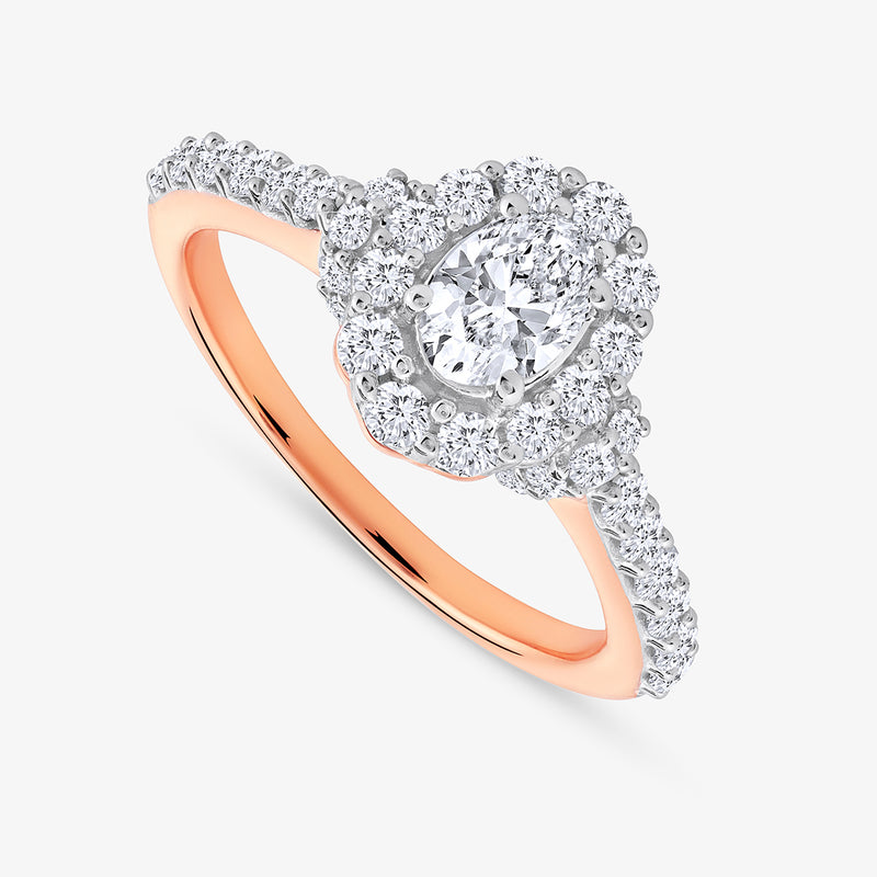 The Petal Glow Diamond Promise Ring by Keemti Jewels features a pear diamond, halo setting, and diamond band.