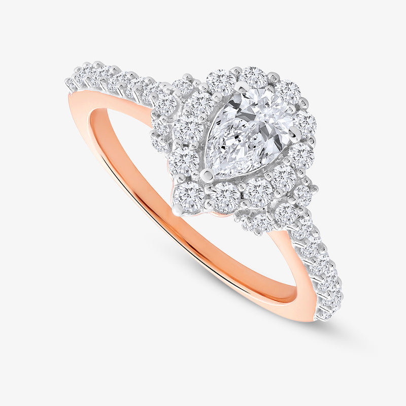 The Dewdrop Bloom Diamond Promise Ring by Keemti Jewels features a pear-cut diamond and halo on a rose gold band.