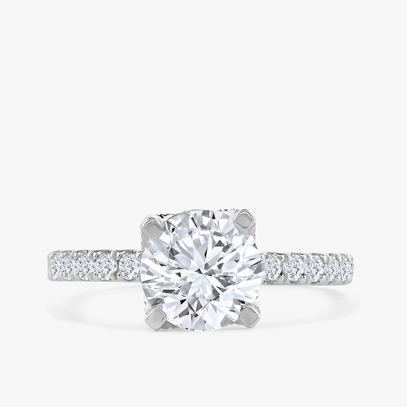 Classic Cushion Solitaire Ring by Keemti Jewels features a cushion diamond center on a platinum band with accent stones.