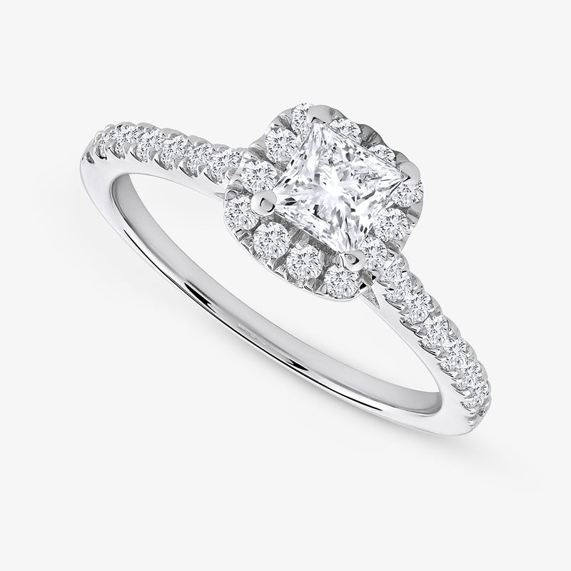The Timeless Frame Of Love Diamond Ring by Keemti Jewels features a princess-cut center and a diamond-studded halo band.