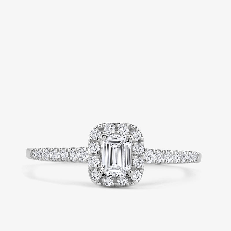 The Eternal Grace Solitaire Ring by Keemti Jewels features an emerald-cut diamond and halo on an elegant white gold band.