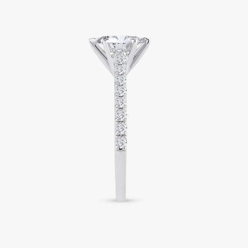 Side view of Keemti Jewels' Forever Marquise Of Love Diamond Ring with a round center and band diamonds.
