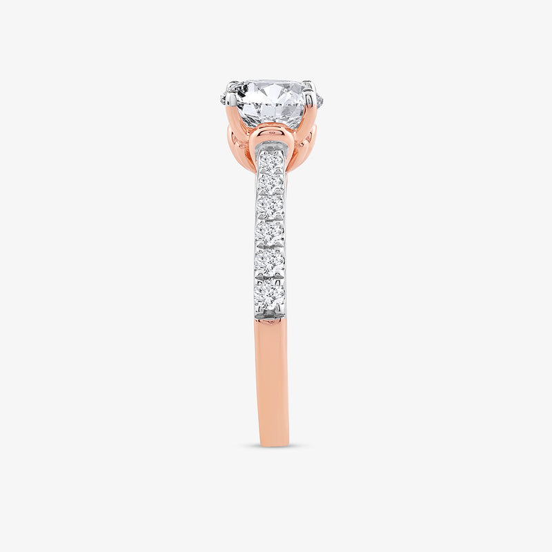 The Keemti Jewels Timeless Cathedral Solitaire Ring features side diamonds and a classic round silhouette in rose gold.