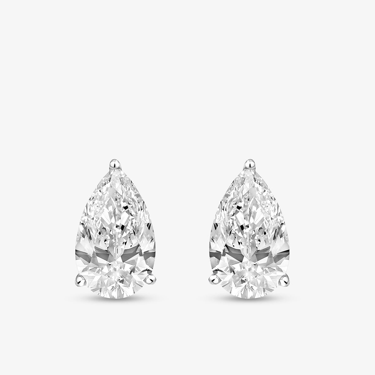 PEARLUXE Solitaire Stud Earrings by Keemti Jewels feature sparkling pear-shaped diamonds in a prong setting.