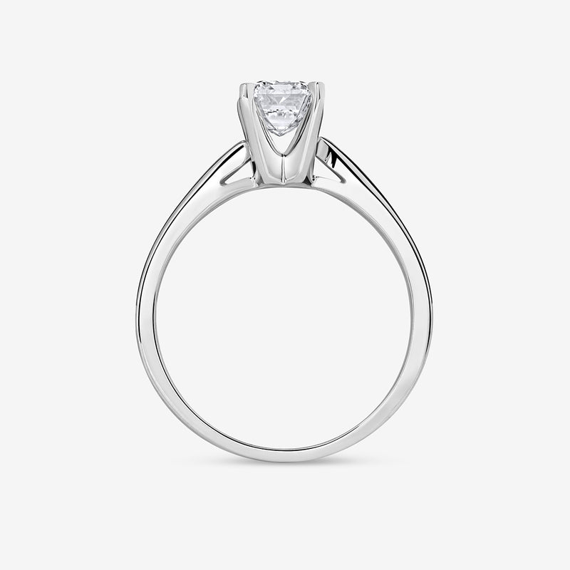 Side view of Keemti Jewels MINIMAL Emerald Solitaire RING with a prong-set center stone on white background.