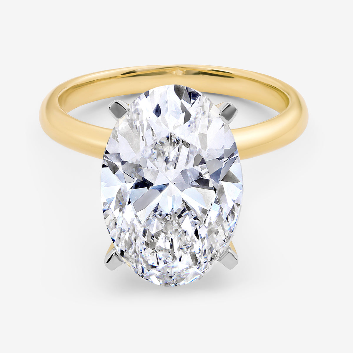 Keemti Jewels MINIMAL Oval Solitaire Ring features a luminous shine and classic four-prong oval centerpiece setting.