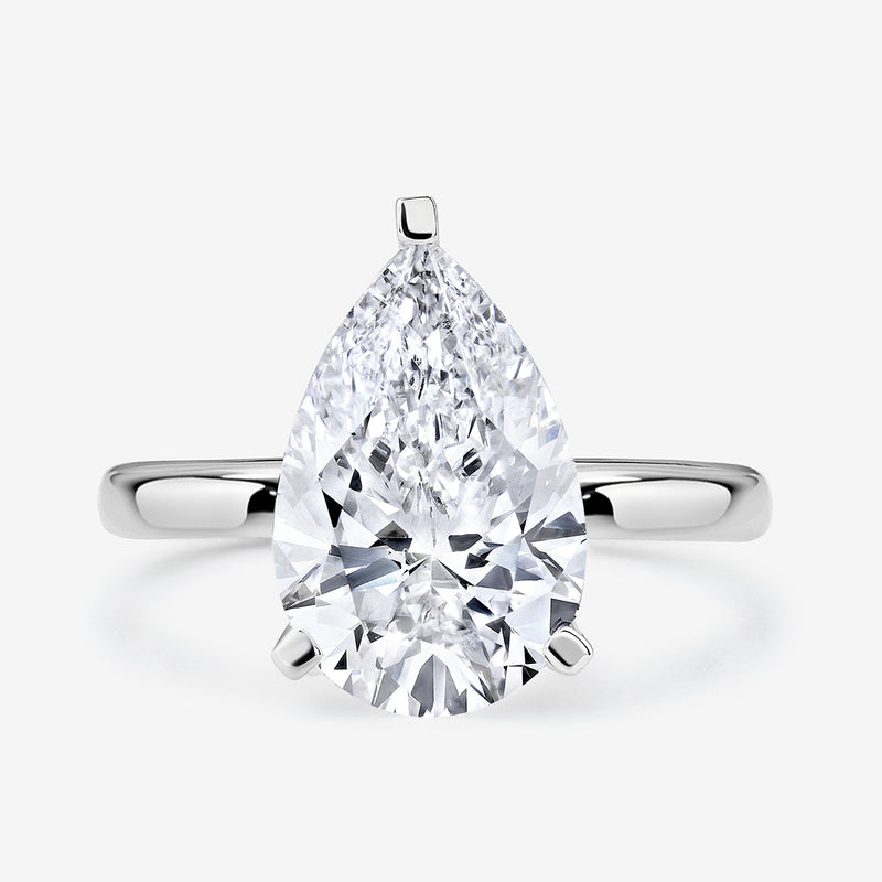The TIMELESS Pear Solitaire RING by Keemti Jewels features a large pear-cut diamond in a classic silver setting.