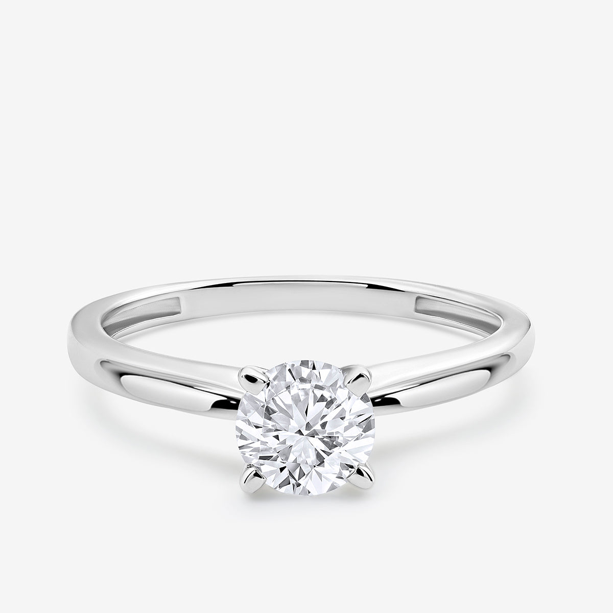 The ELEGANT Round Solitaire RING by Keemti Jewels showcases a round center diamond in a four-prong silver setting.