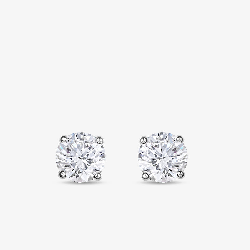 Keemti Jewels TIMELESS Solitaire Stud Earrings feature sparkling stones in four-prong white metal settings.