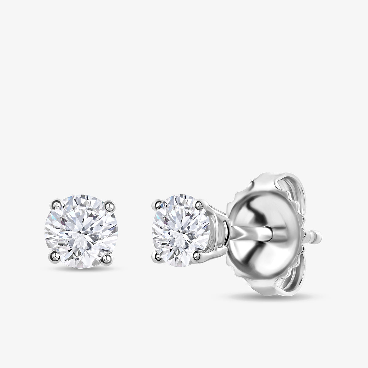 Keemti Jewels TIMELESS Solitaire Stud Earrings feature sparkling stones in silver four-prong settings with butterfly backs.