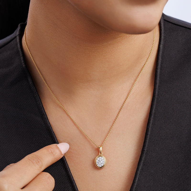 Worn oval cluster necklet with gold-tone chain and small sparkling oval pendant