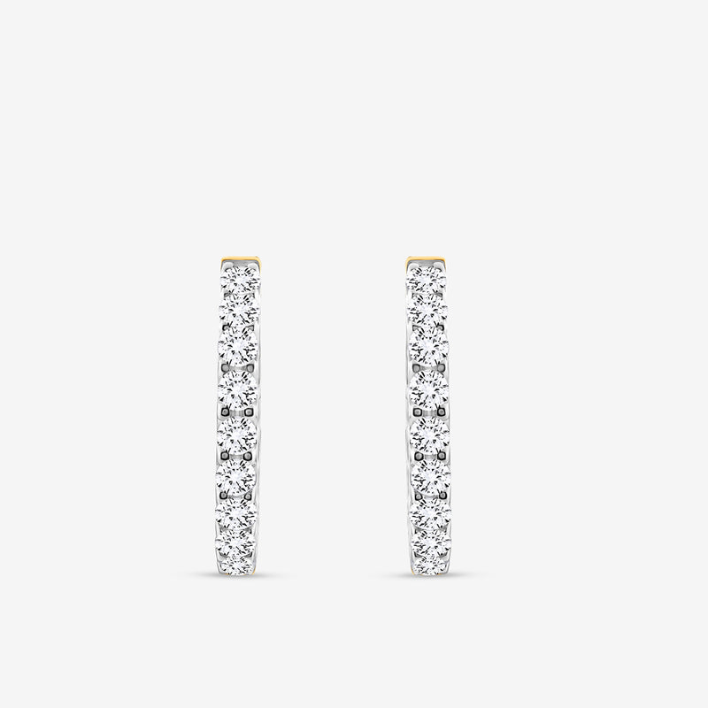 The CLASSIC Glow Huggie EARRINGS by Keemti Jewels are slim gold hoops, shown vertically on a plain white background, with the front encrusted in sparkling diamonds for continuous shimmer.