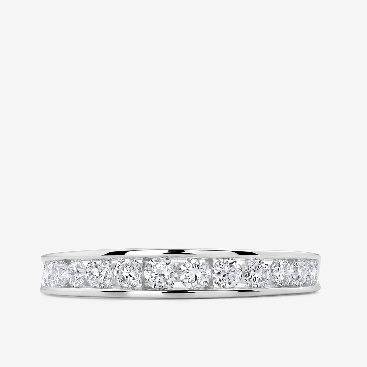 Twisted shank ring with clear round stones across the band, silver tone.