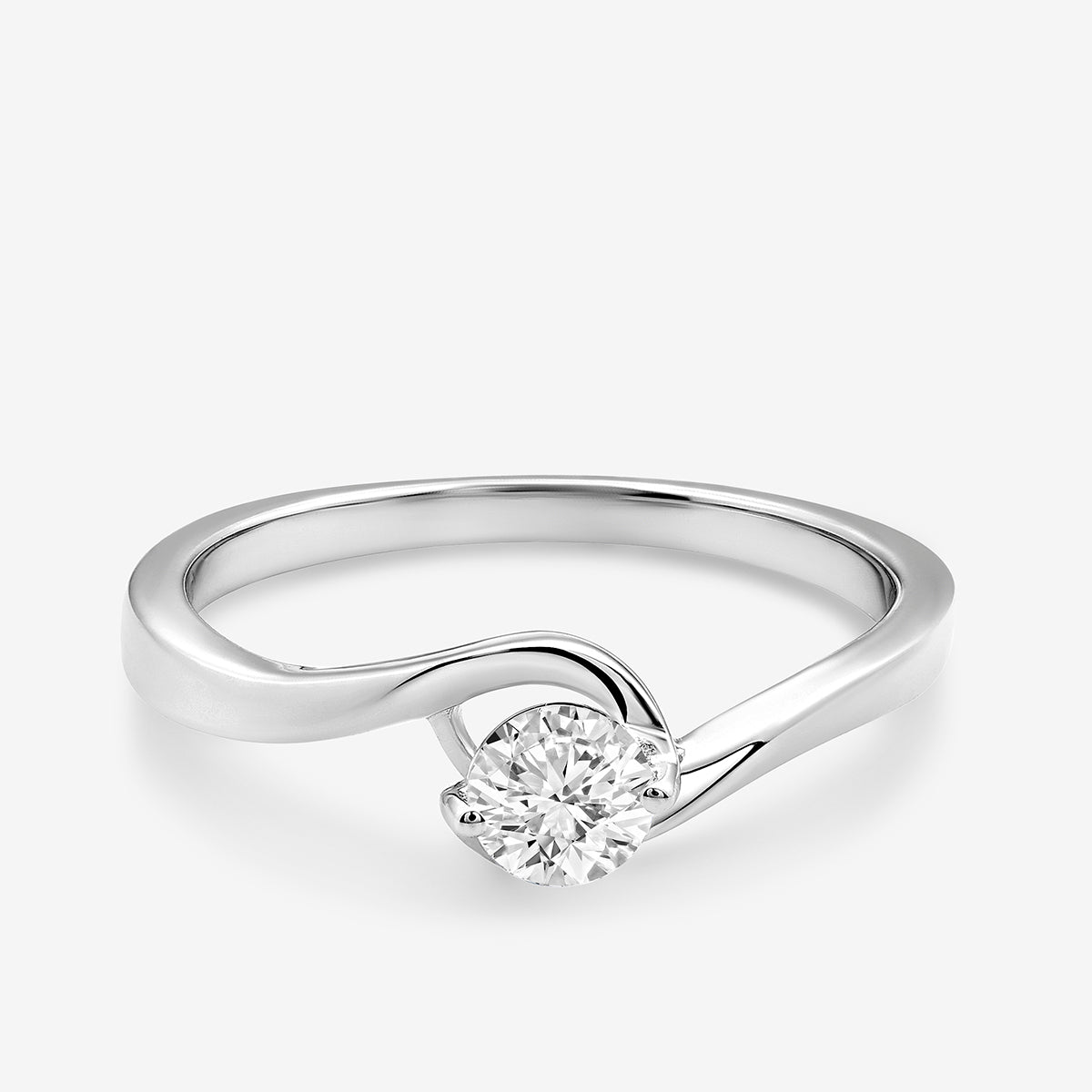 The RADIANT Swirl RING by Keemti Jewels features a twisted band with a single round diamond at the center.