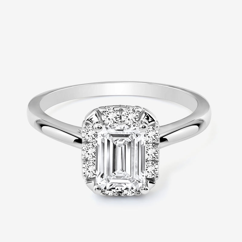 The Keemti Jewels EMERA Halo Solitaire Ring features an emerald-cut center with pavé-set and halo round diamonds.