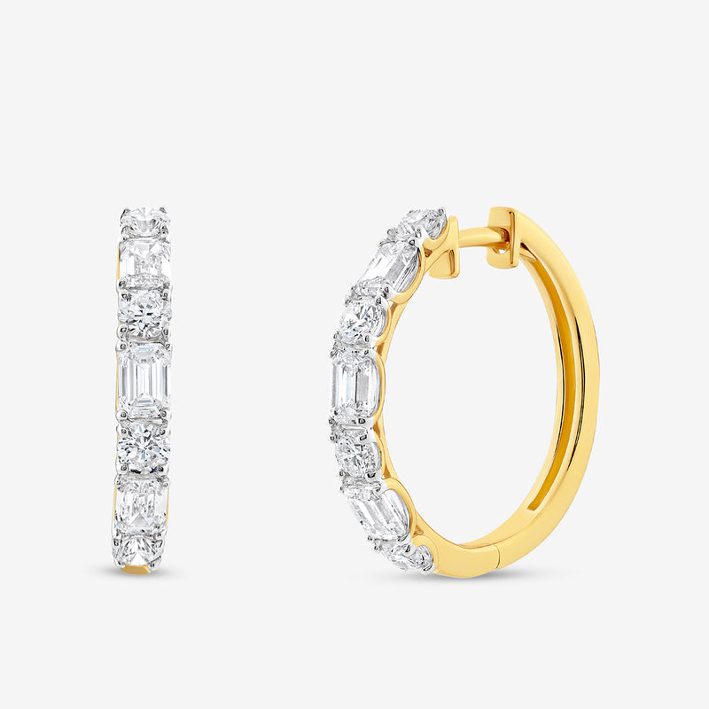 Keemti Jewels SOFT Spark Huggie Earrings: Gold hoops with oval and emerald-cut white stones for everyday wear.
