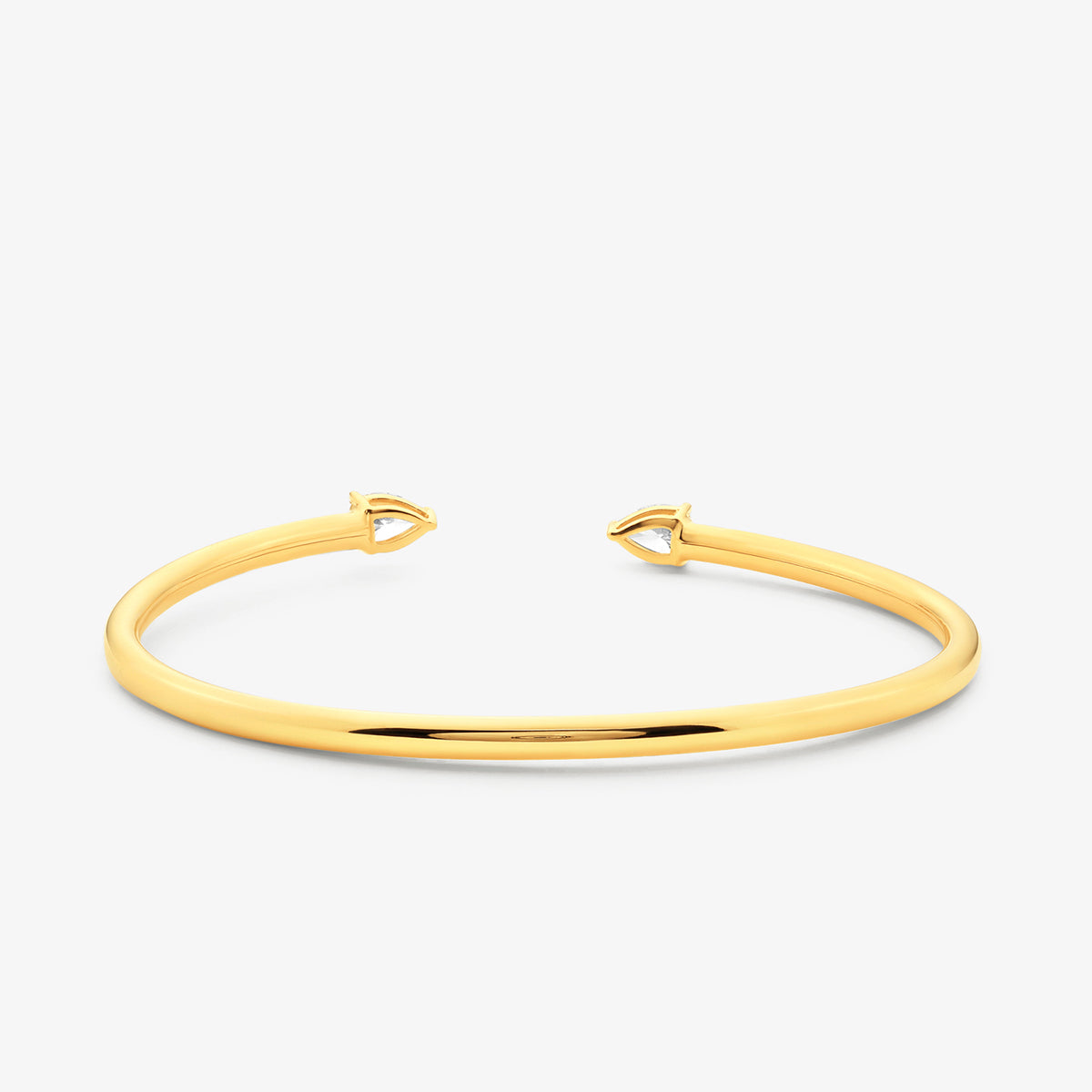 Keemti Jewels' PEAR Luxe BRACELET features pear-shaped ends and a polished gold band, shown on a white background.