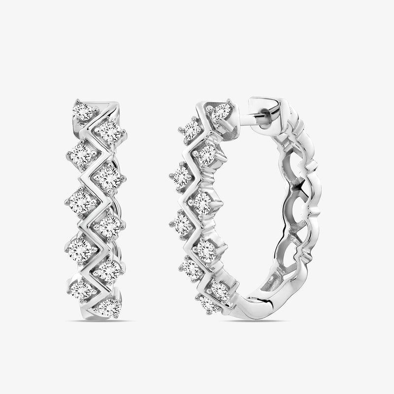 The Keemti Jewels ENTWINED Spark Hoop Earrings feature a silver zigzag design with round white gemstones.