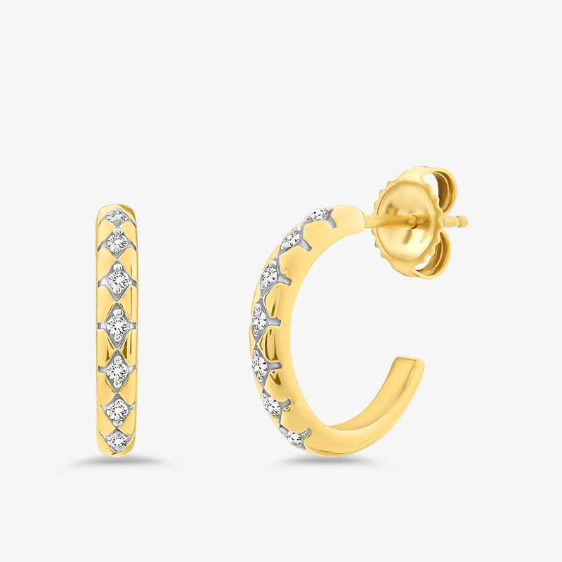 Gold-tone hoop earrings with small sparkle stones set along the outer curve