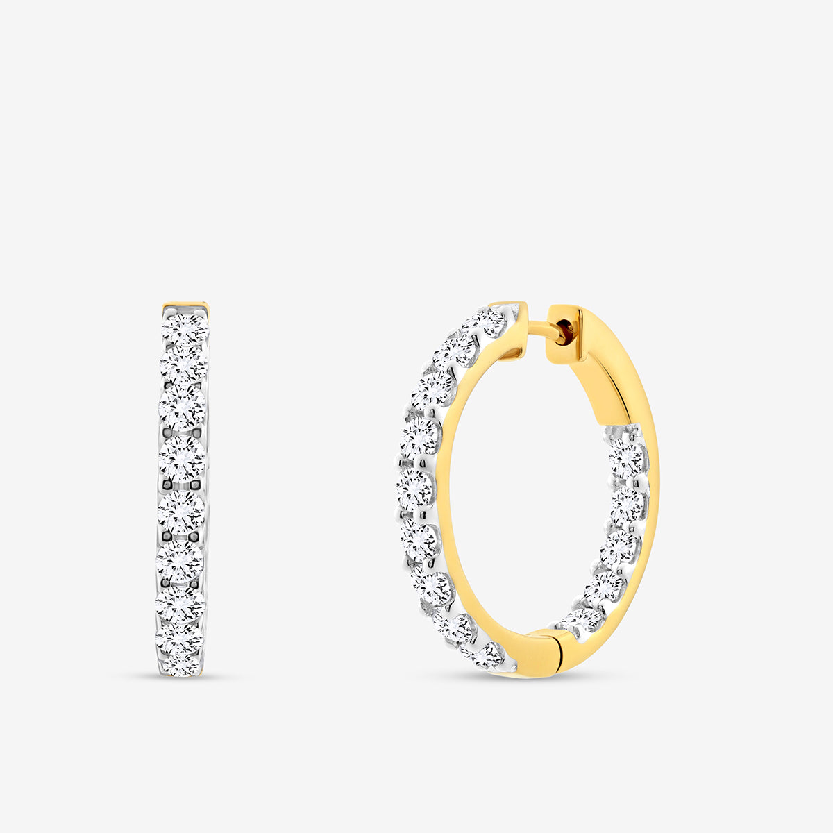 The CLASSIC Glow Huggie EARRINGS by Keemti Jewels feature small round diamonds along the outer edge in a sleek hoop design, shown from both side and front angles against a plain white background.