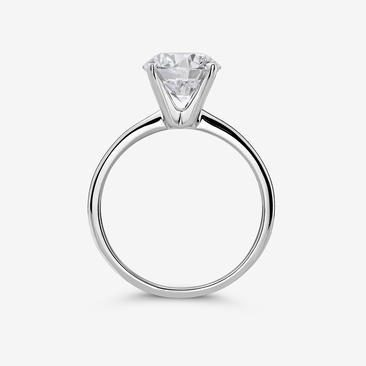 The ELEGANT Round Solitaire RING by Keemti Jewels features a round stone in a six-prong setting on a simple silver band.