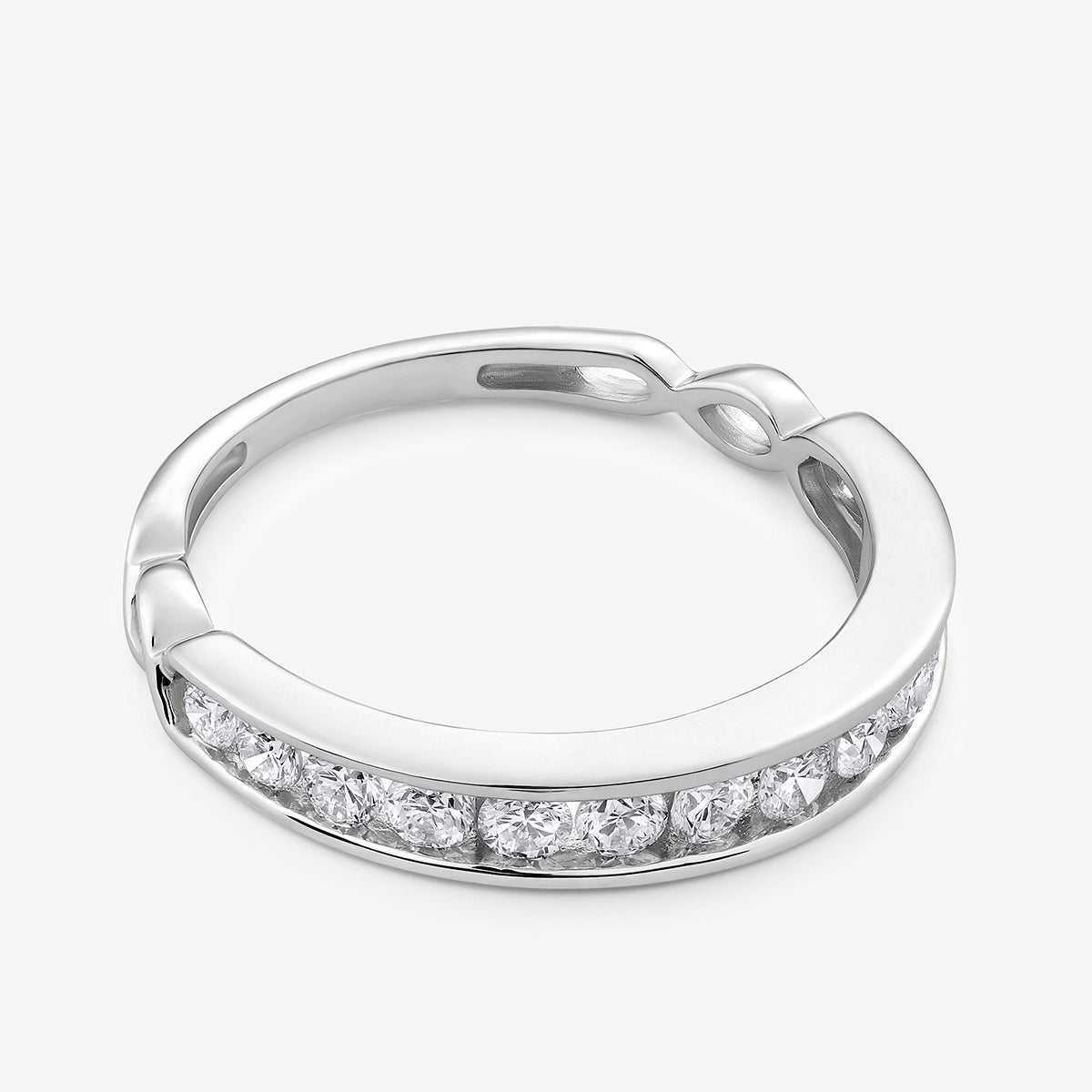 Twisted shank ring, side view: continuous row of clear round stones in silver tone.