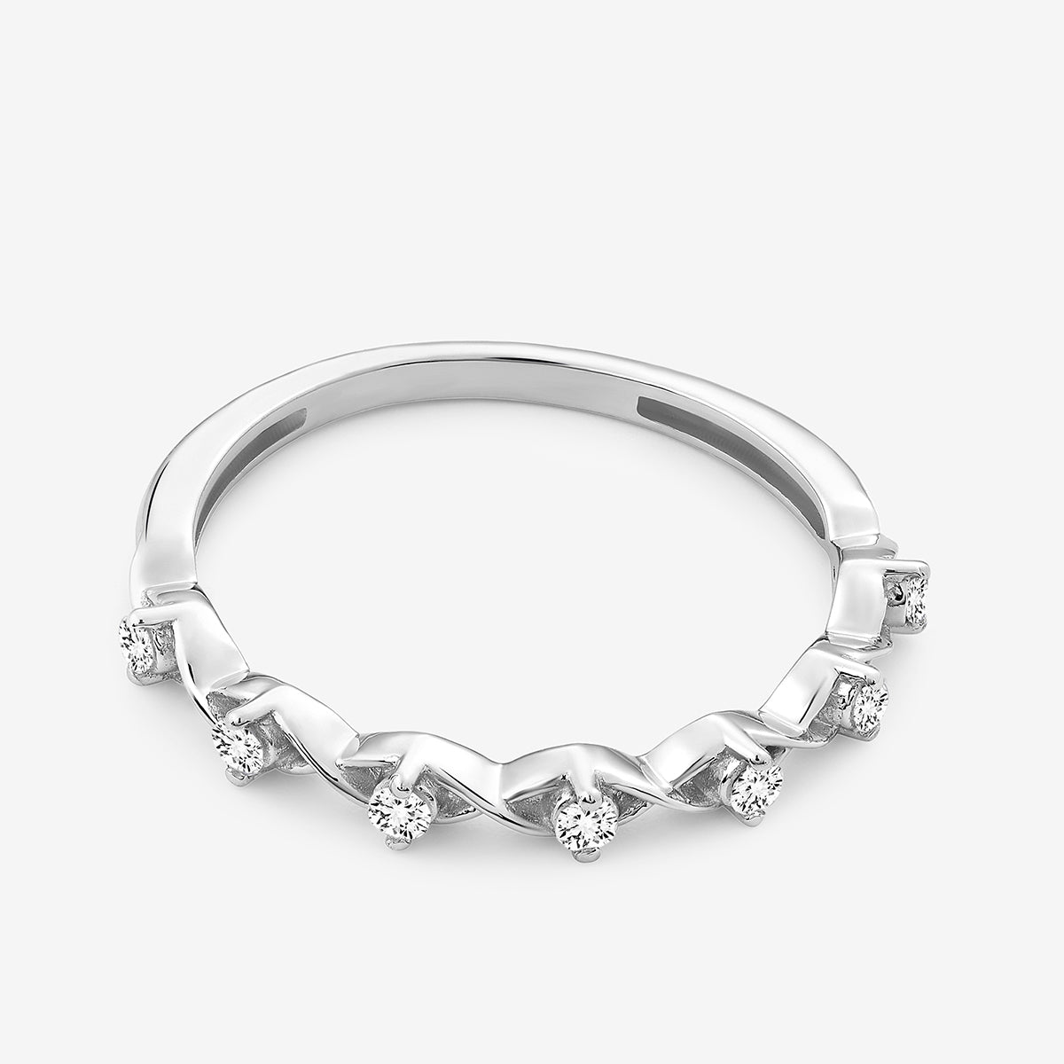 Keemti Jewels’ CROWN Curve Diamond RING: a white gold chevron band with small round diamonds on top.