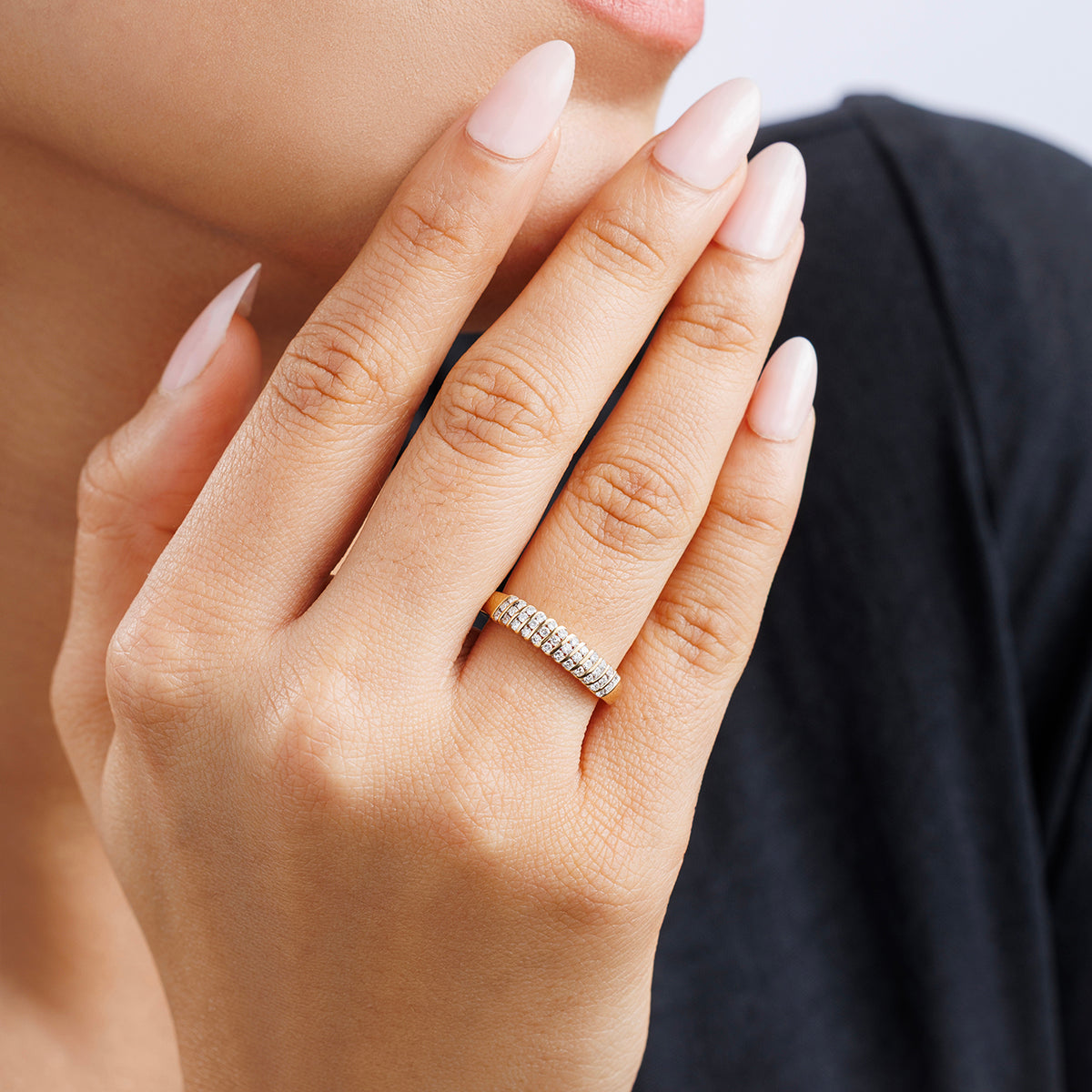 SPIRAL groove band ring worn on hand, full row of small white stones across the band