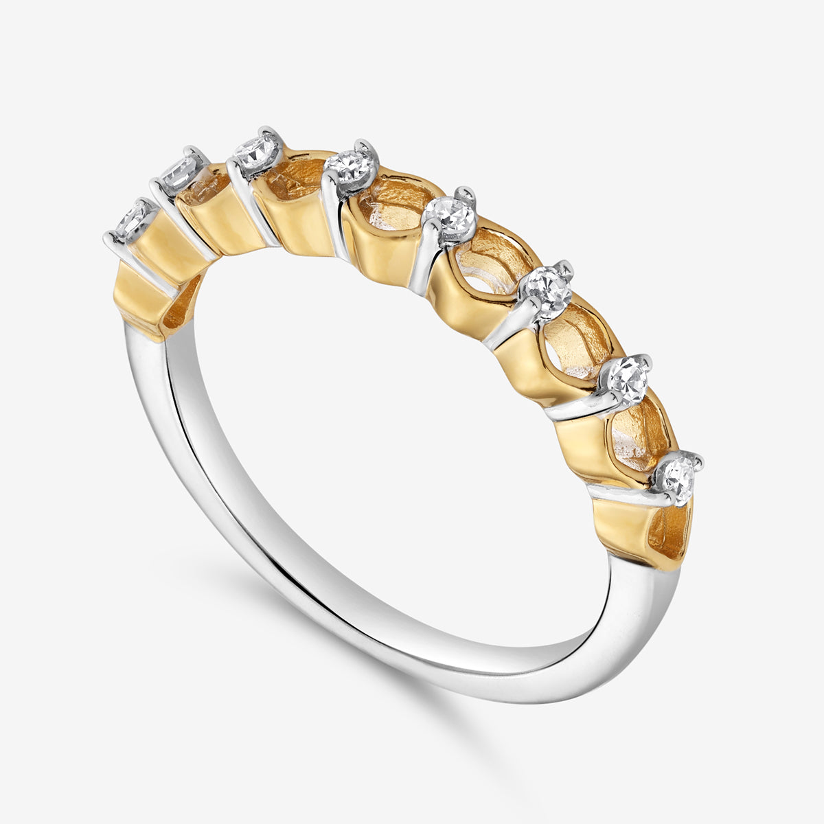 The CREST Twist Diamond Ring by Keemti Jewels features seven diamonds in a sculpted, two-tone gold and silver design.