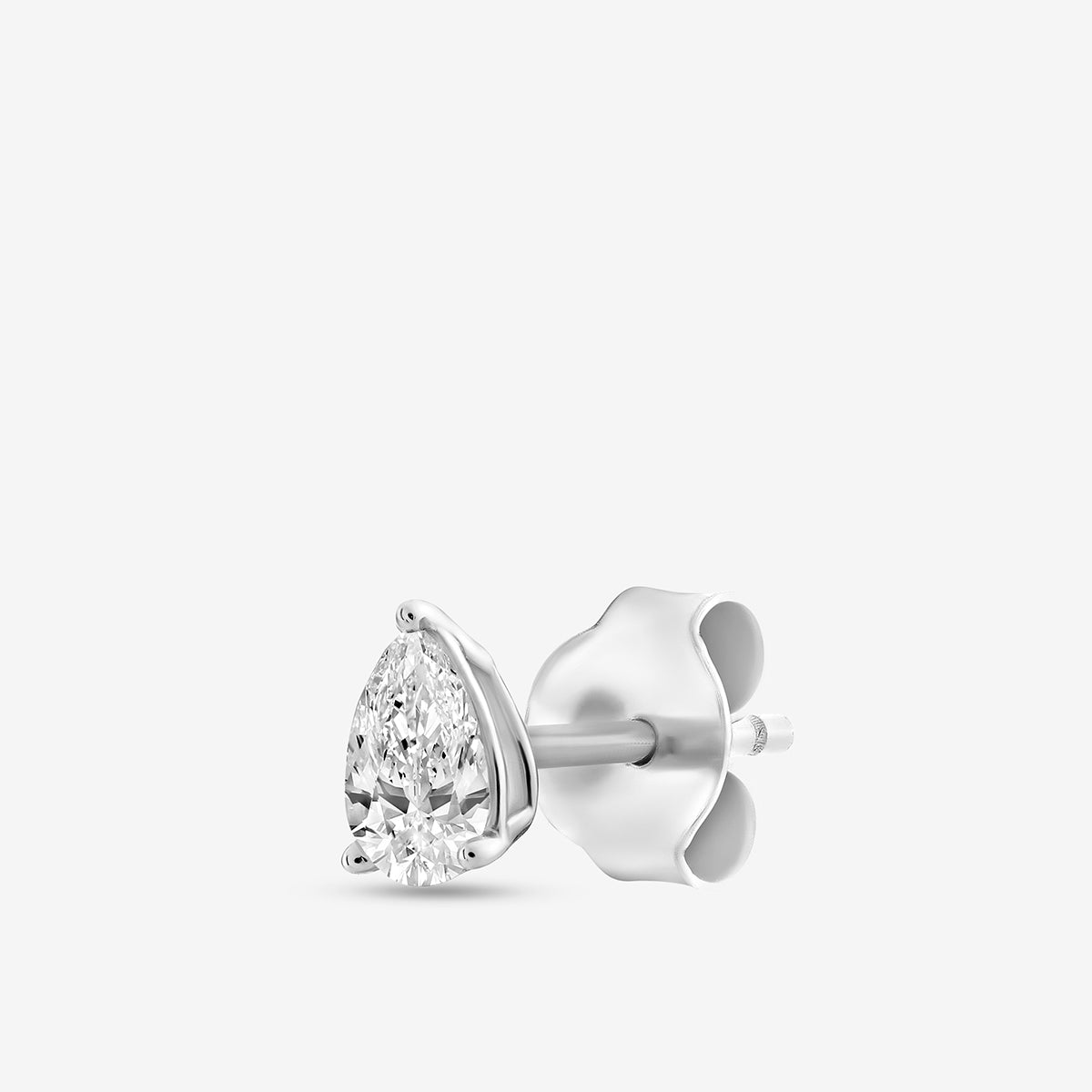 The PEARLUXE Solitaire Stud Earring by Keemti Jewels features a pear-shaped gem in a silver prong setting.