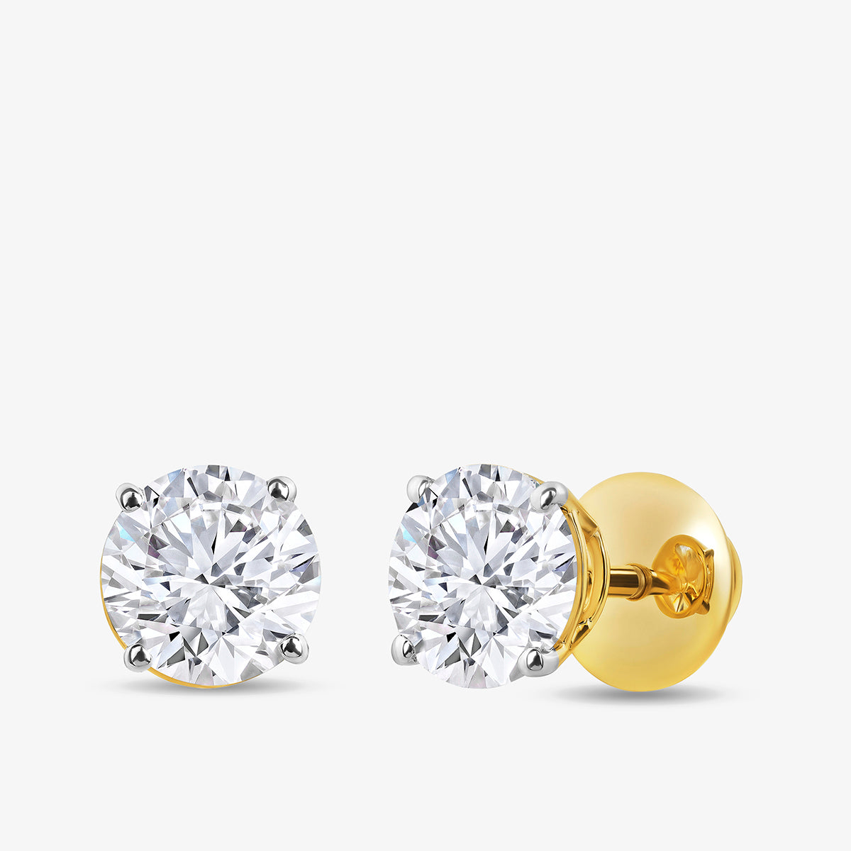 Keemti Jewels TIMELESS Solitaire Stud Earrings in gold and silver with sparkling stones on a white background.