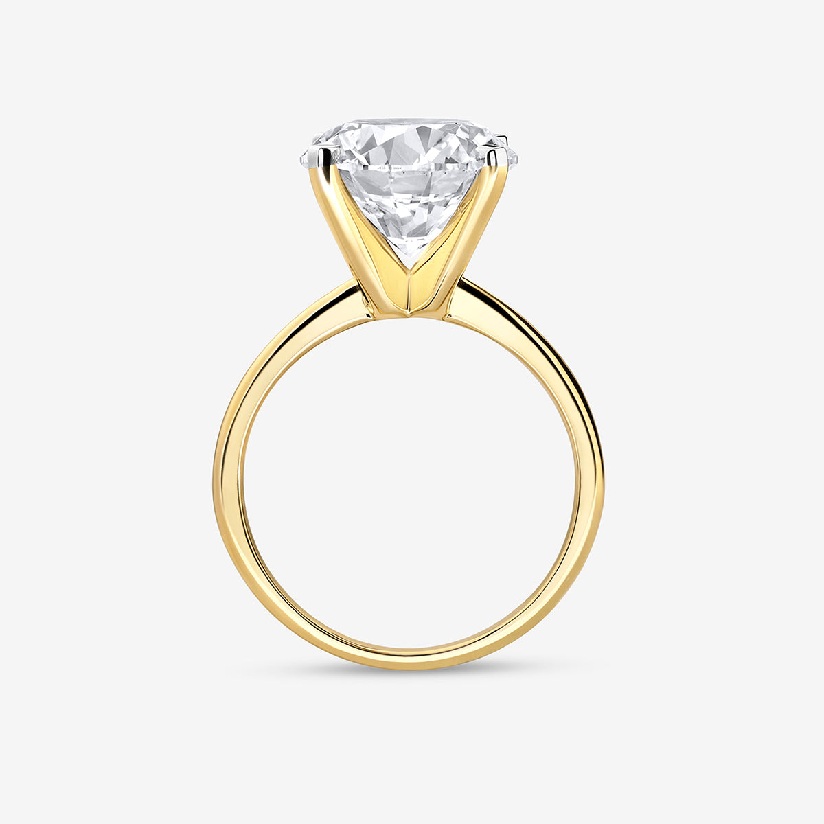 The ELEGANT Round Solitaire RING by Keemti Jewels features a gold setting and large round diamond, side view shown.
