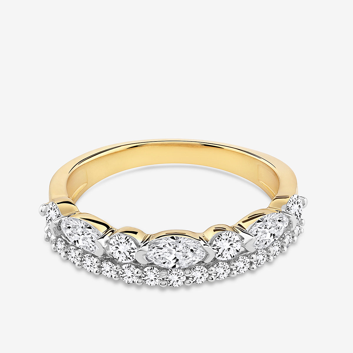 The OVAL Grace RING by Keemti Jewels features a gold band with oval and round diamonds in a white metal crown.