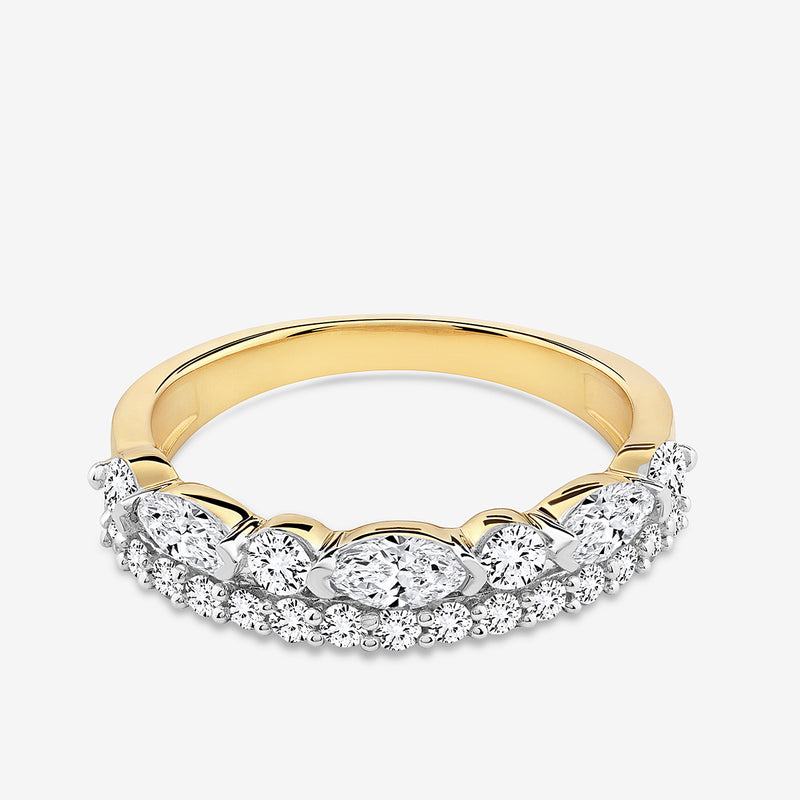 The OVAL Grace RING by Keemti Jewels features a gold band with oval and round diamonds in a white metal crown.