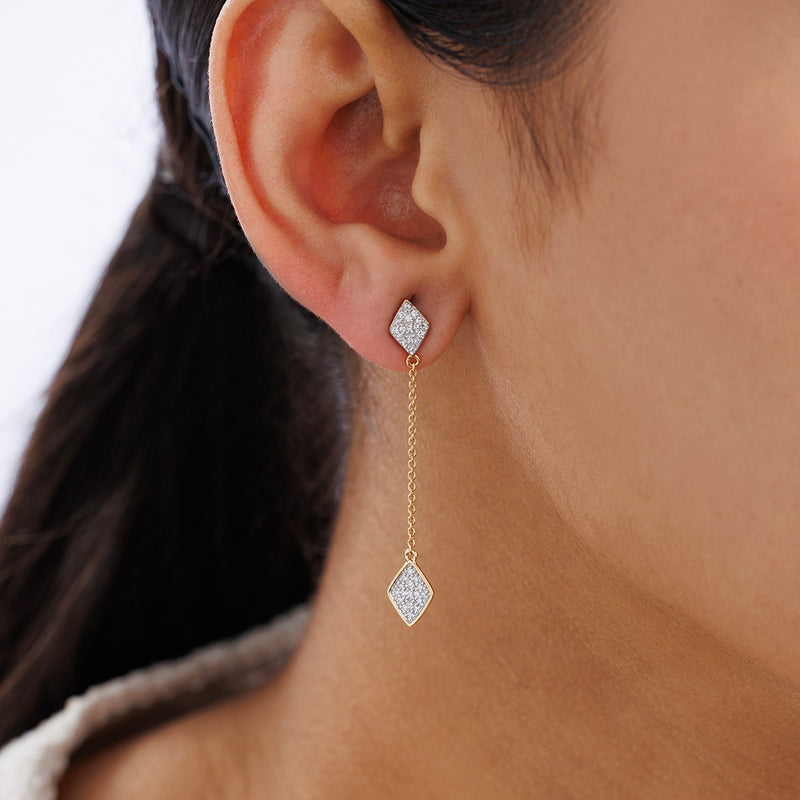 Close-up of a woman's ear wearing Keemti Jewels AMARA Square Dangler Earrings with a geometric diamond motif.