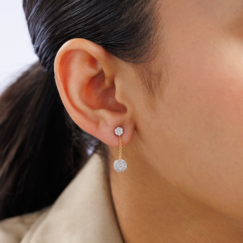 Close-up of a woman's ear wearing Keemti Jewels ORBIT Glow Dangler EARRINGS with diamond dangles on a gold chain.
