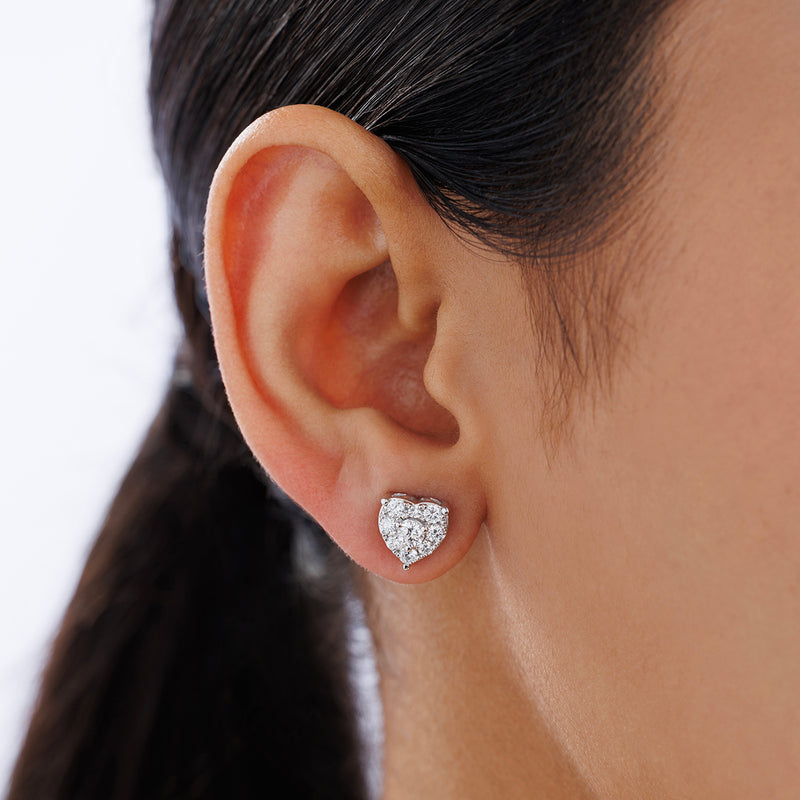 A close-up of an ear wearing Keemti Jewels PURE Heart Stud EARRINGS adds a touch of everyday elegance.