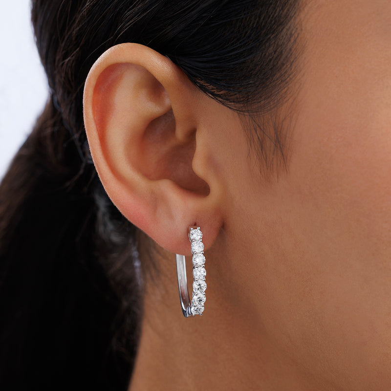 Close-up of a woman's ear in Keemti Jewels CLASSIC Weave Hoop EARRINGS, adding everyday elegance with sparkle.