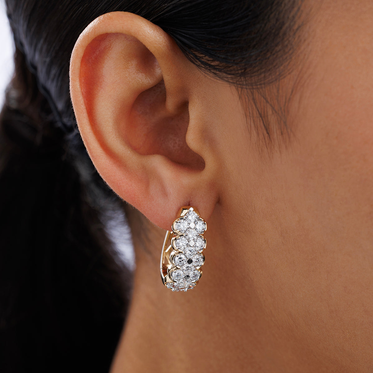 Close-up of a modern ear wearing Keemti Jewels' CLASSIC Lattice Hoop EARRINGS with sparkling lattice details.