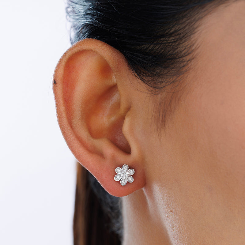 A close-up of a woman's ear wearing Keemti Jewels MINI Floral Stud EARRINGS, perfect for everyday elegance.