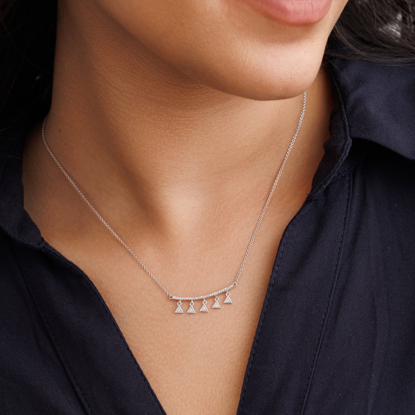 Worn triangle charm drop necklet with five small triangle pendants