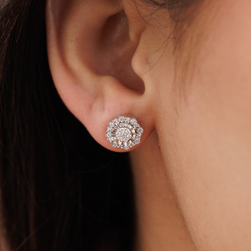 Worn SNOWFLAKE Bloom stud earrings, small halo of pavé stones on the ear