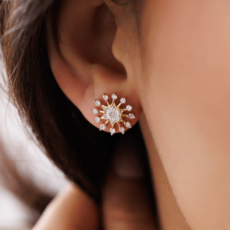 Worn Snow Frosted Grace stud earrings: gold-tone starburst with sparkling round stones