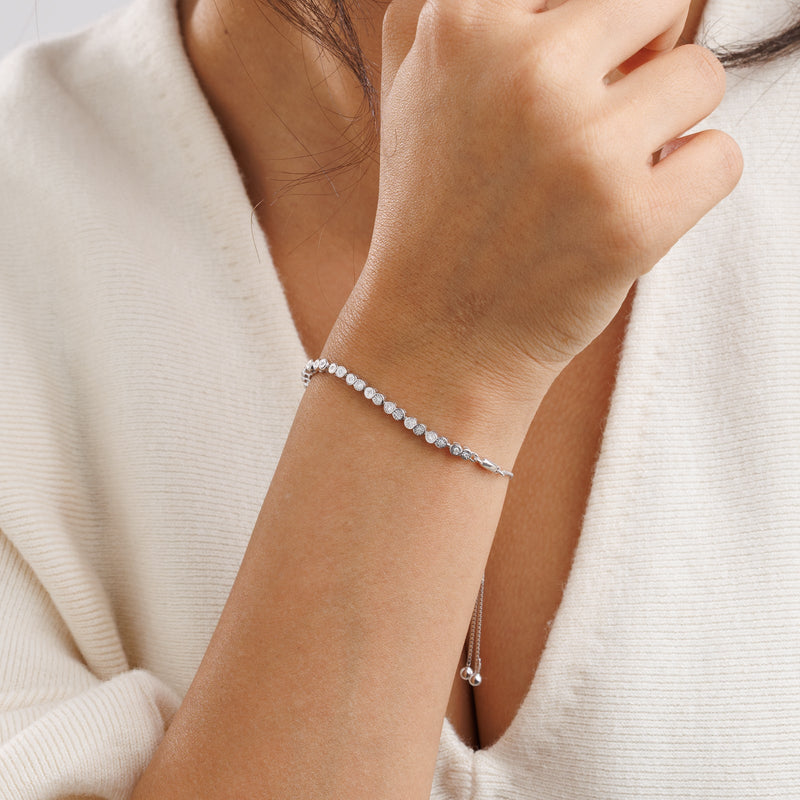Eternity bolo bracelet on wrist, silver 925 with round pavé stones and slide clasp
